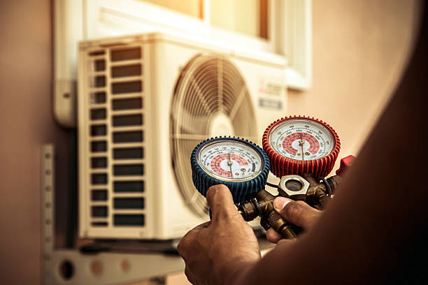 Professional Air Conditioning Service technician working in Newton, IL